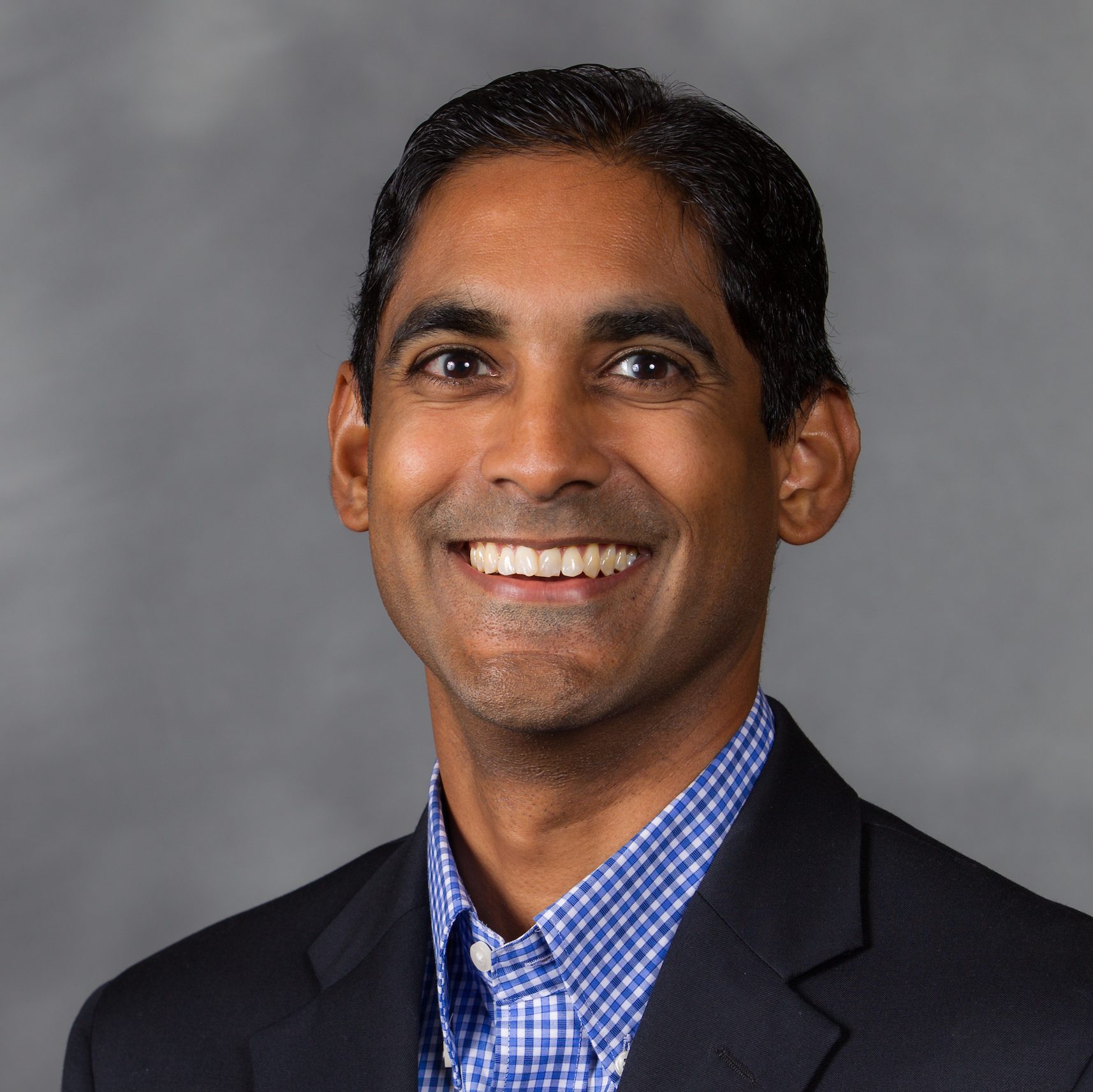 New faculty headshots during orientation, Wednesday, August 14, 2013. John Sumanth, Business.