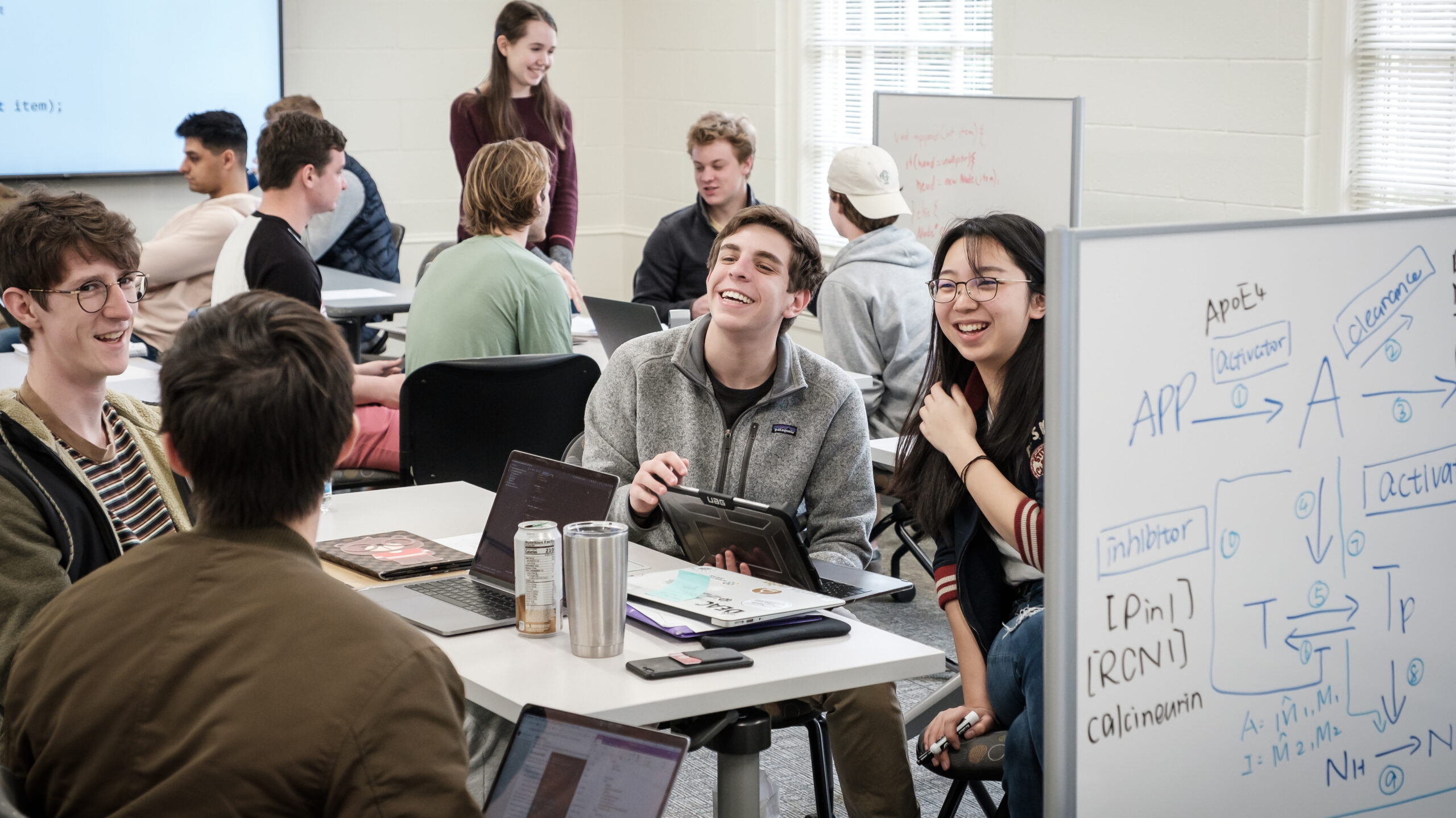 Students in Computer Science 112 with professor Sarra Alqahtani work in small groups to write code in the C++ programming language, in Manchester Hall on Thursday, March 5, 2020.