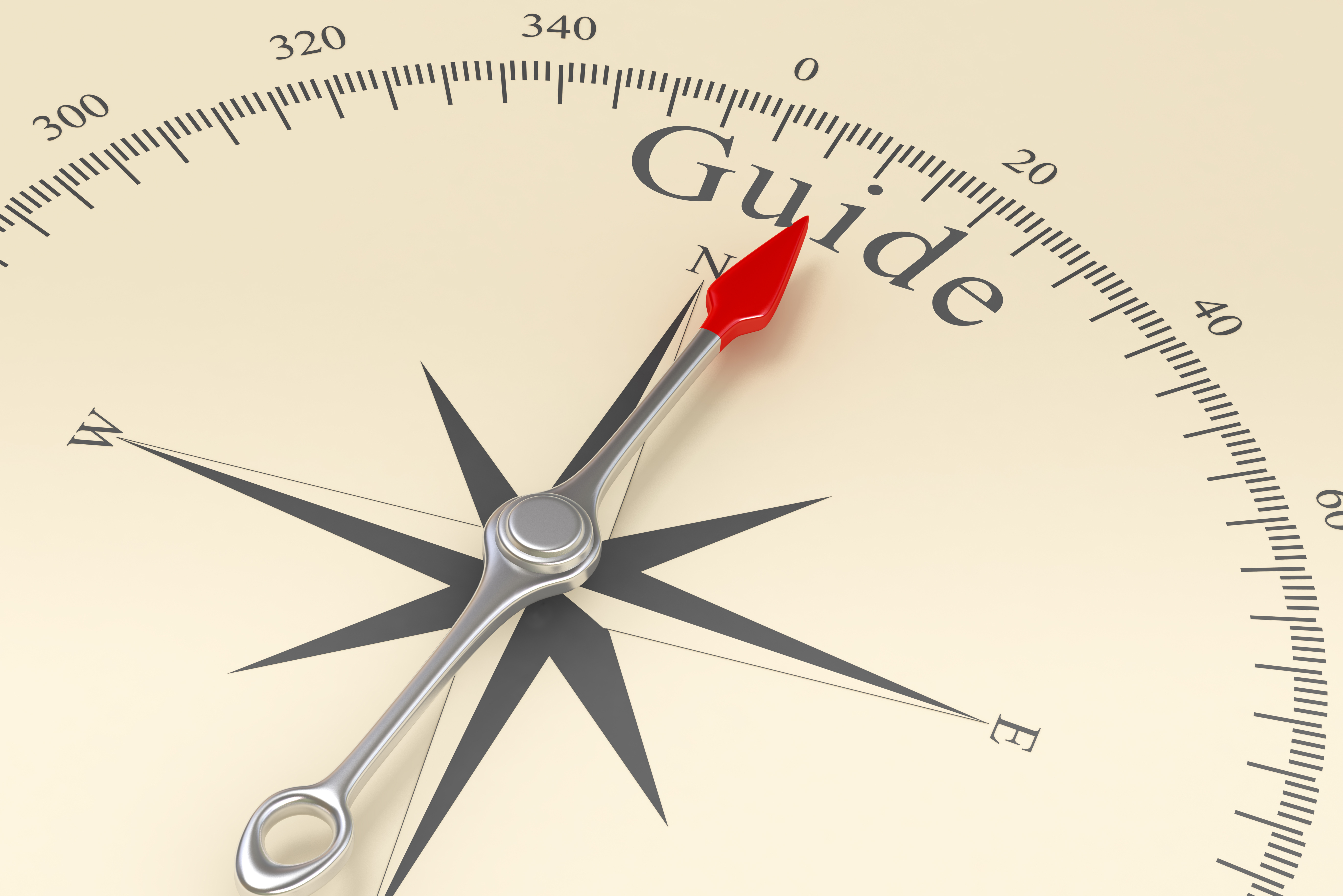 decorative image of a compass with "guide" written at the top.