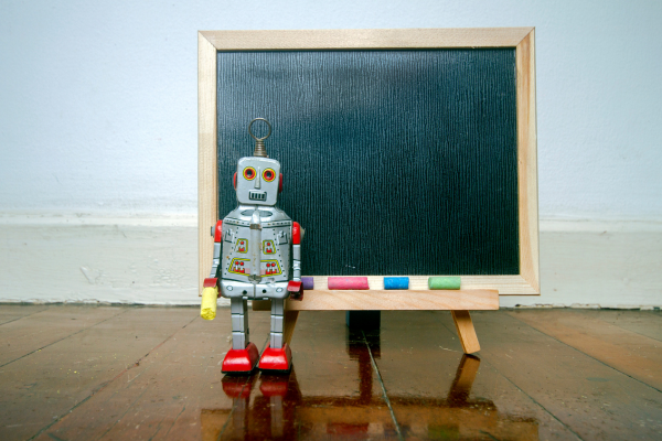 robot teacher in front of chalkboard