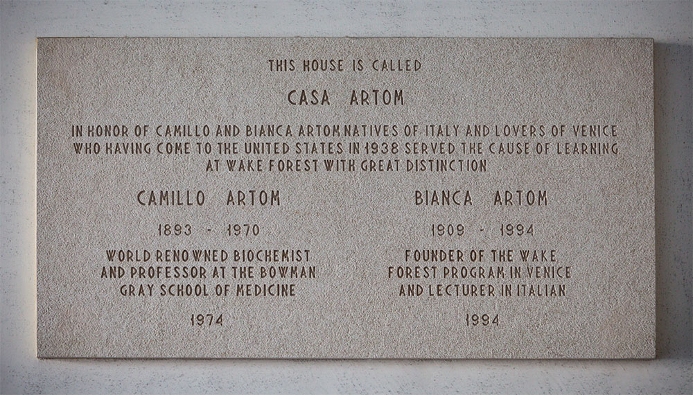 sign that reads This House is called Casa Artom and honors Camillo and Bianca Artom