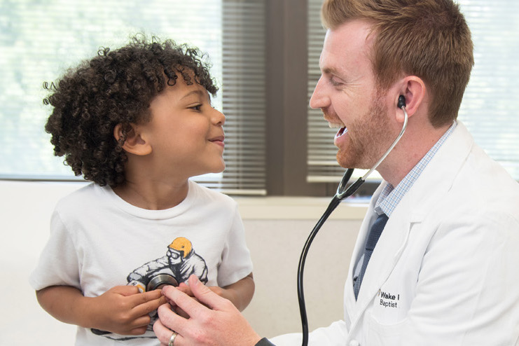 Nurse Practitioner examining a pediatric patient