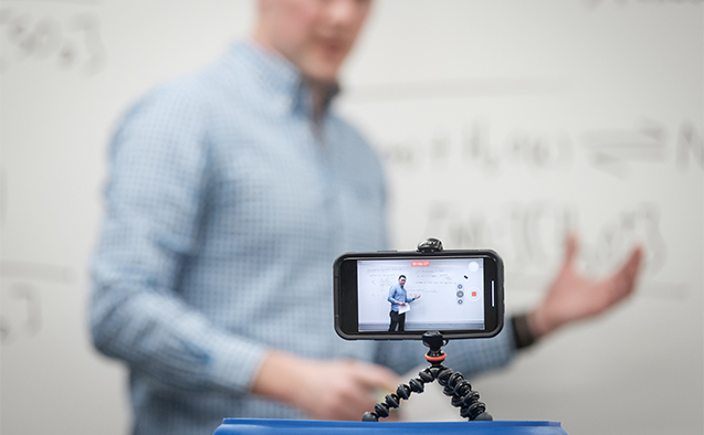 Mobile device recording professor at the board