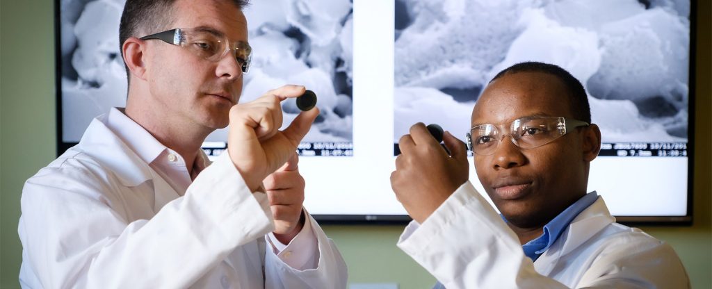 Wake Forest engineering professor Michael Gross works with postdoc Sixbert Picard Muhoza (PhD '19) in the engineering lab of at Wake Downtown.