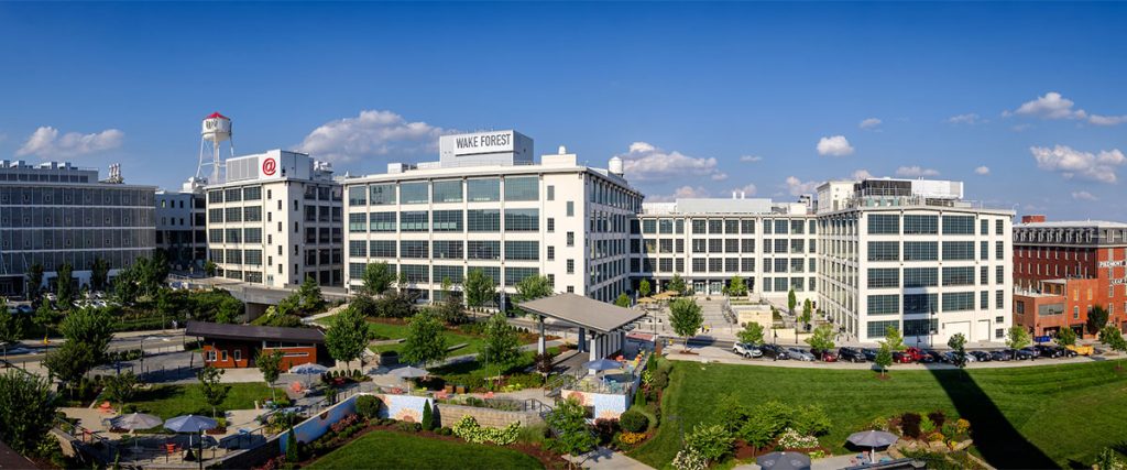 A panoramic image of the Wake Downtown campus and Bailey park