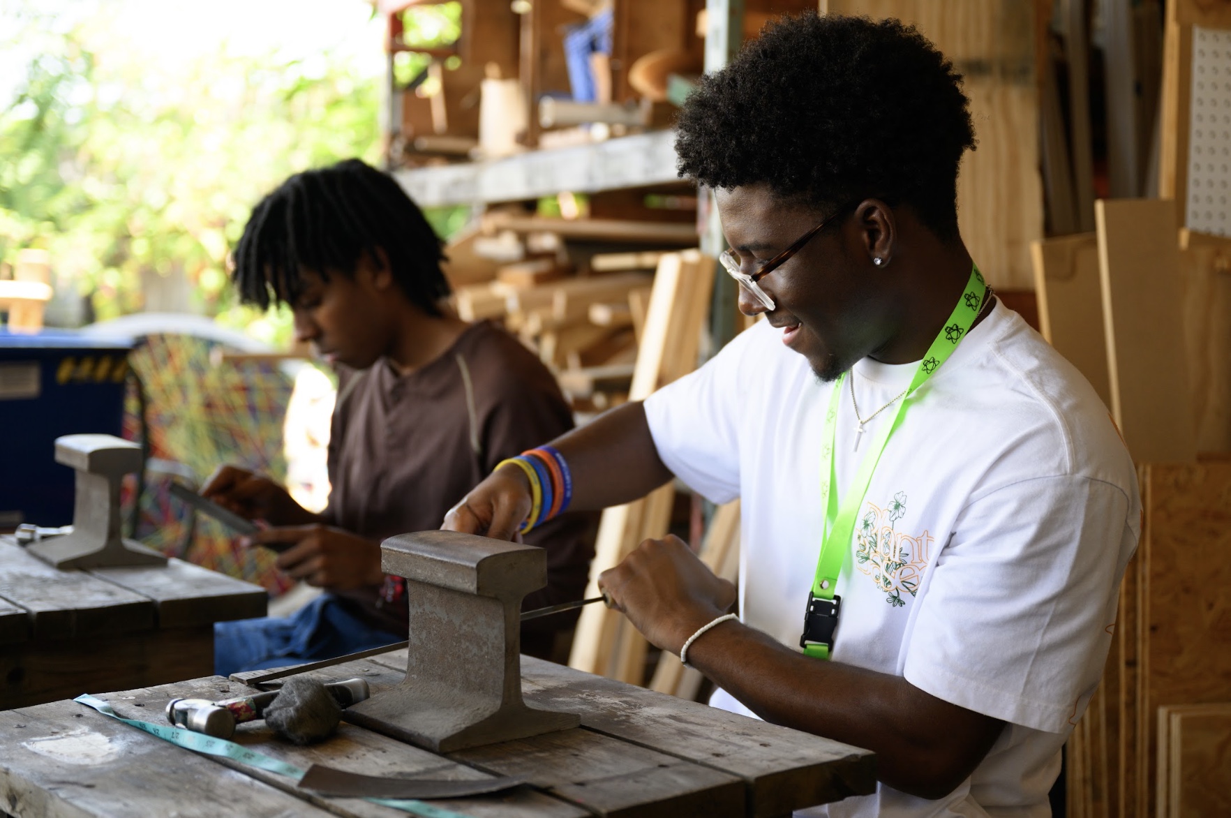 LEAP Interns using metalworking techniques to make copper bracelets during field trip to WS Mixxer Community Makerspace. 