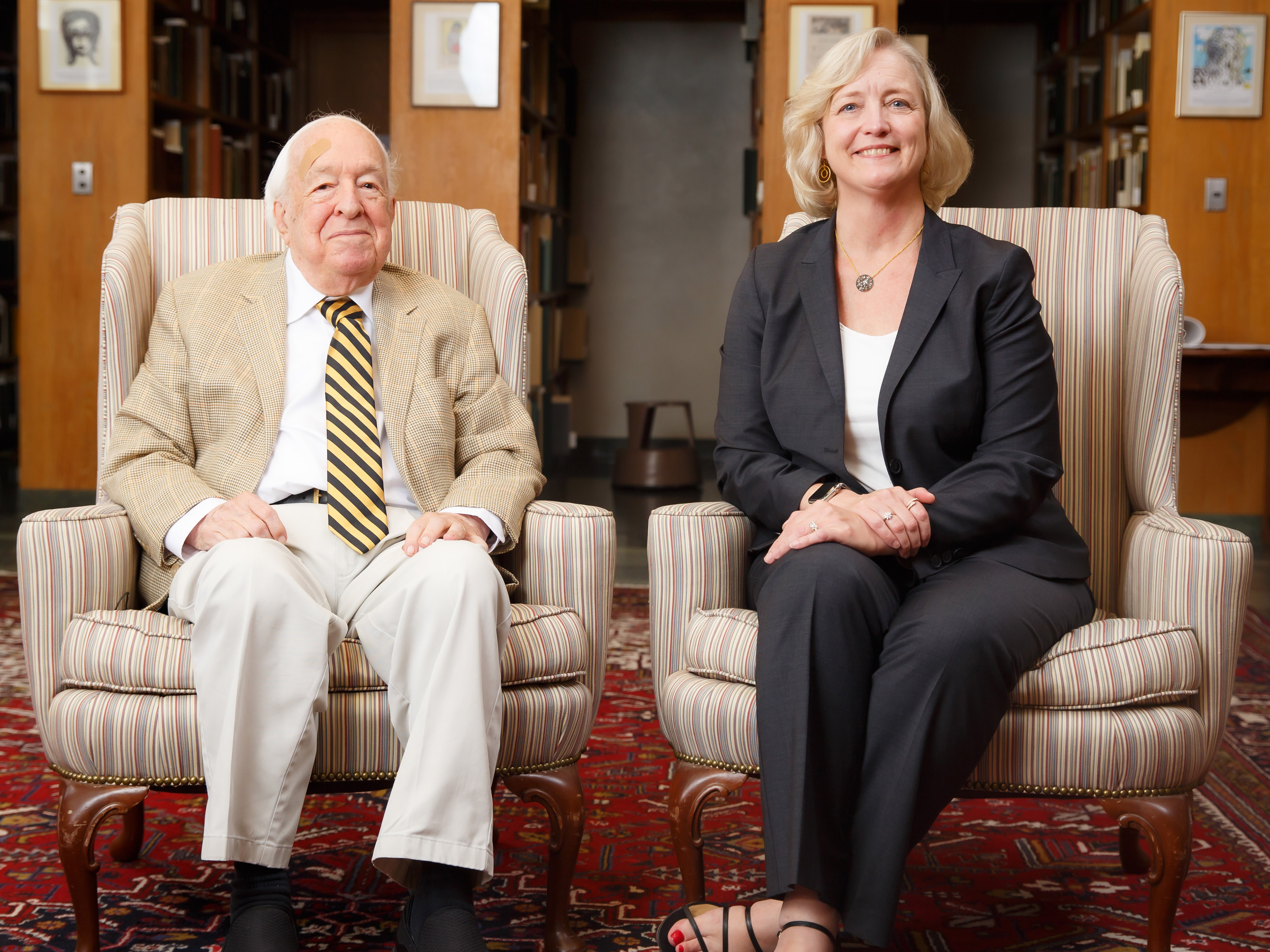Susan Wente and Ed Wilson pose in the library.