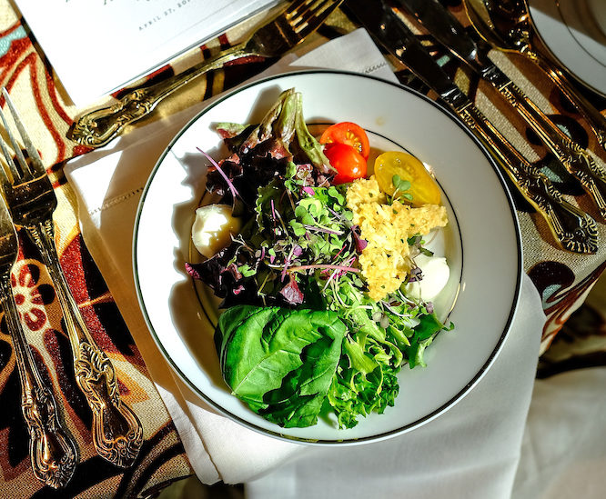 Photo of a plated salad placed on a table.