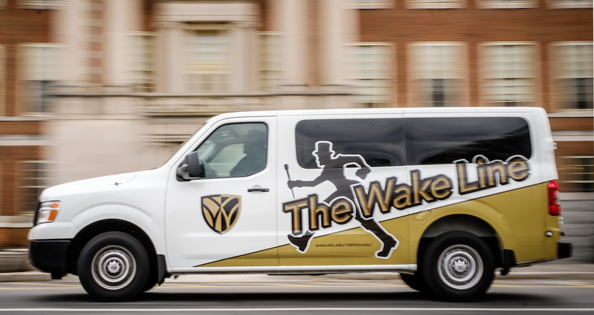 A Wake Line shuttle van sports new Demon Deacon graphics outside the library on Wednesday, January 10, 2018.