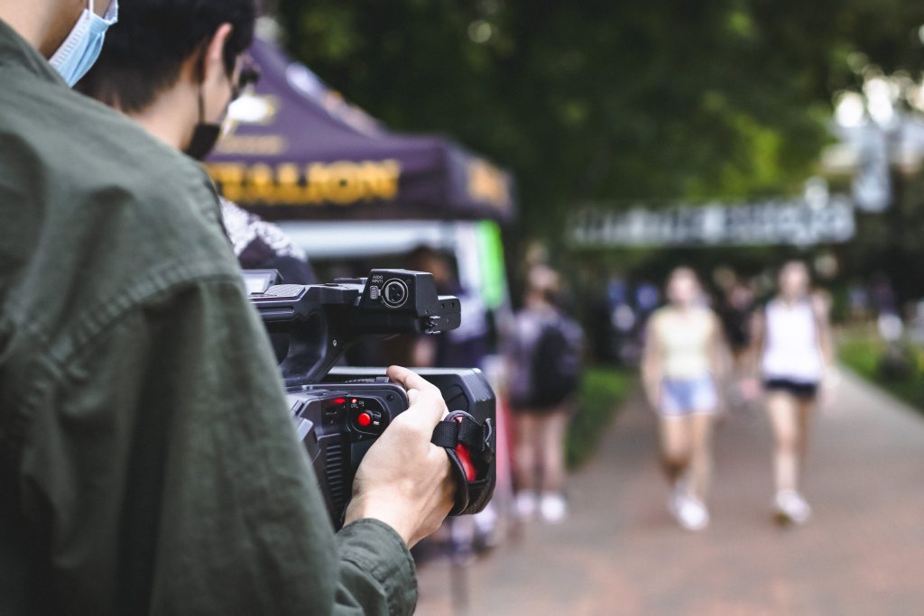 video camera focused on students walking