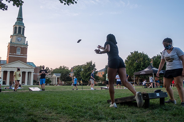 Students play cornhole