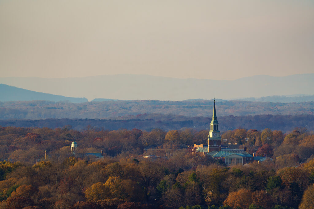 Image of Winston-Salem in the fall featuring Wait Chapel and the mountains.