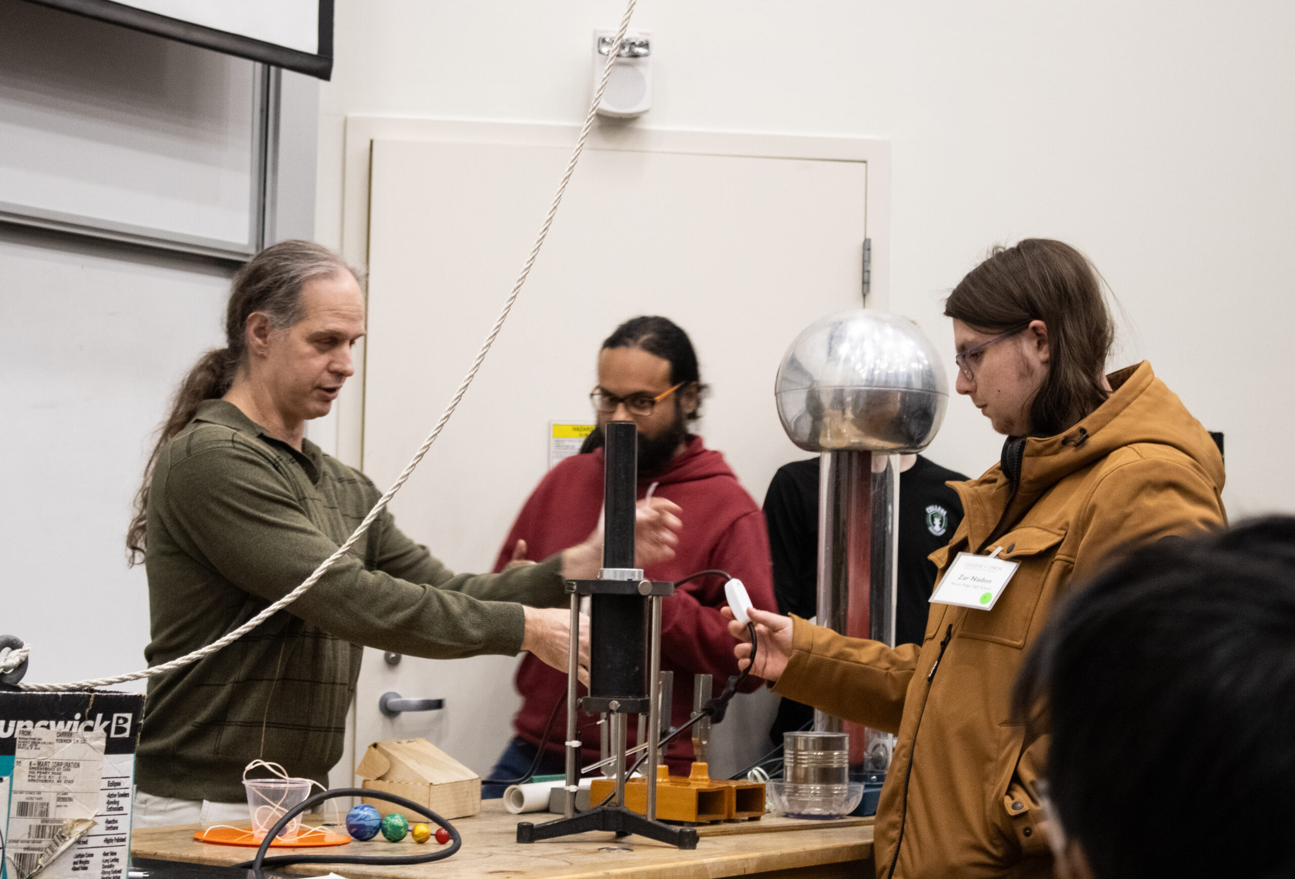 Wake Forest Physics Professor conducting an experiment with College LAUNCH Scholar, Zar.