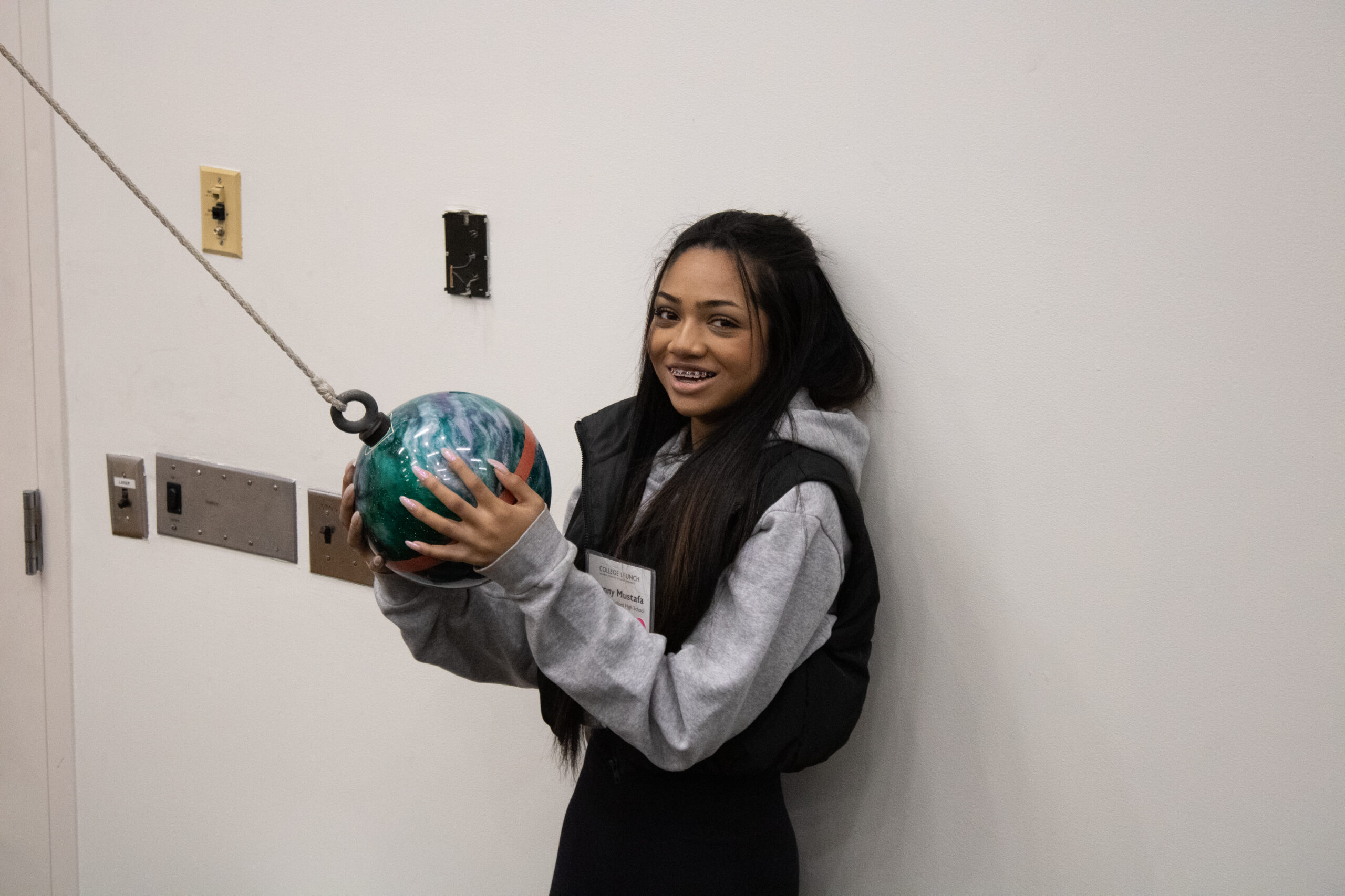 College LAUNCH student conducting an experiment.