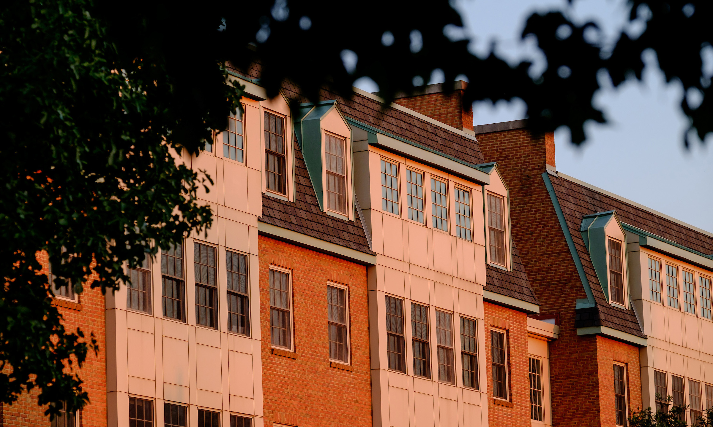 Photograph of Polo Residence hall at sunset