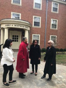 A photo of the distinguished alum outside of Bostwick Hall before their tour