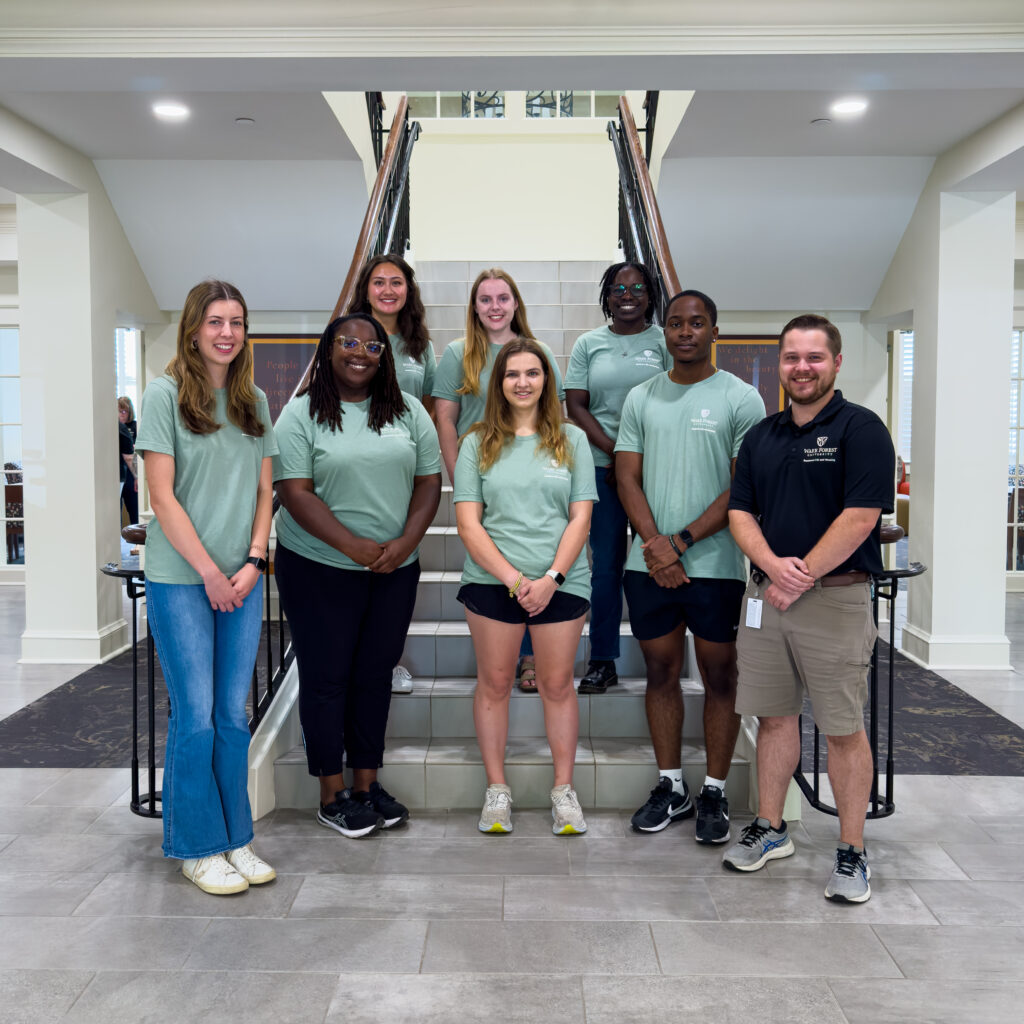 Deacon Place staff photo with RAs, the CD, and the GHD