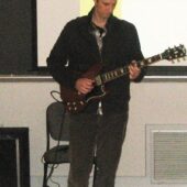 CSI Talent Show: Second Year Student Playing the Guitar