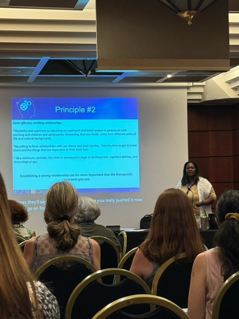 Photo of Dr. Michelle Ghoston presenting the IAC Conference in Italy in July 2024.