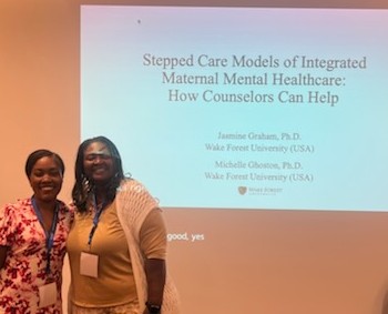 Dr. Jasmine Graham (left) and Dr. Michelle Ghoston present Stepped Care Models of Integrated Maternal Mental Healthcare: How Counselors Can Help at IAC Conference in Italy - Summer 2024.