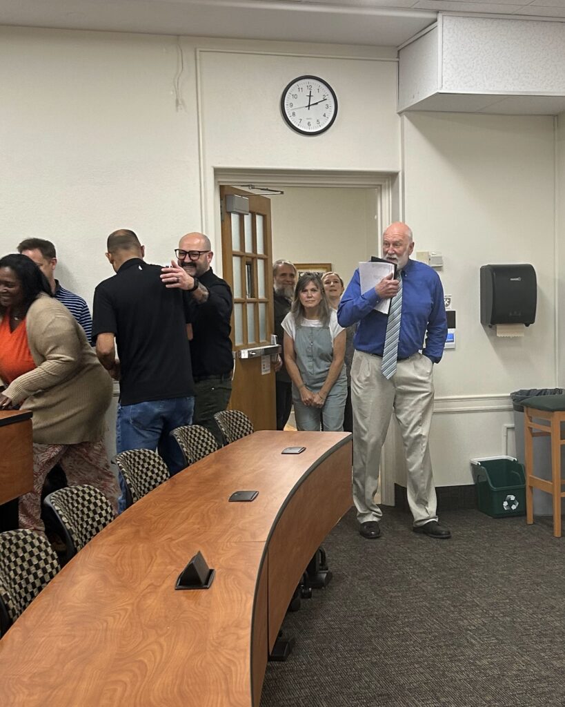 Dr. Bob Nations entering hist surprise retirement celebration.