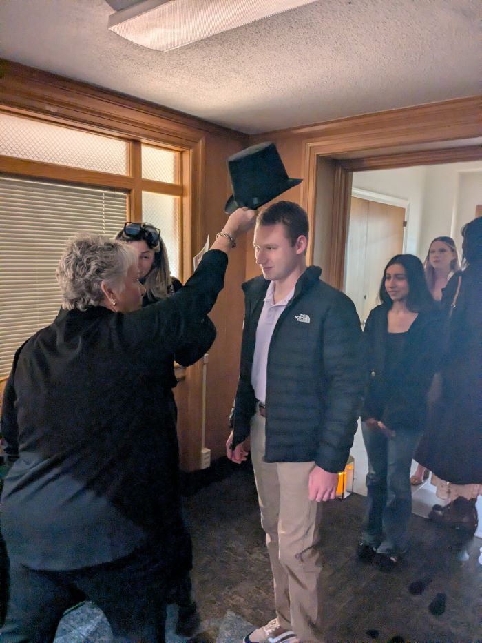 A student is "sorted" into their "house" for the evening.