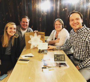 Group of 4 people around a table from the Call to Conversation in Richmond, VA on March 4, 2020