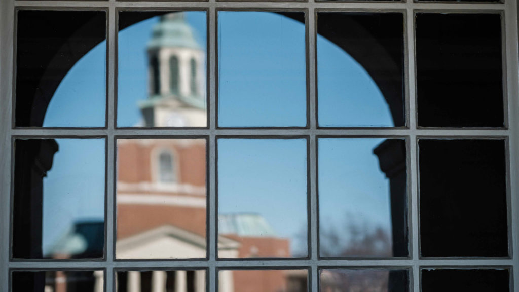 Decorative photo of Wait Chapel as seen through a window pane