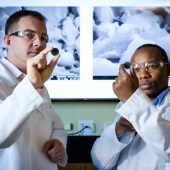 Principal investigator Michael D. Gross, Ph.D. (pictured above, left) and Sixbert P. Muhoza, Ph.D., (right) postdoctoral research scientist