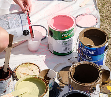 Colorful paint cans at DESK student event