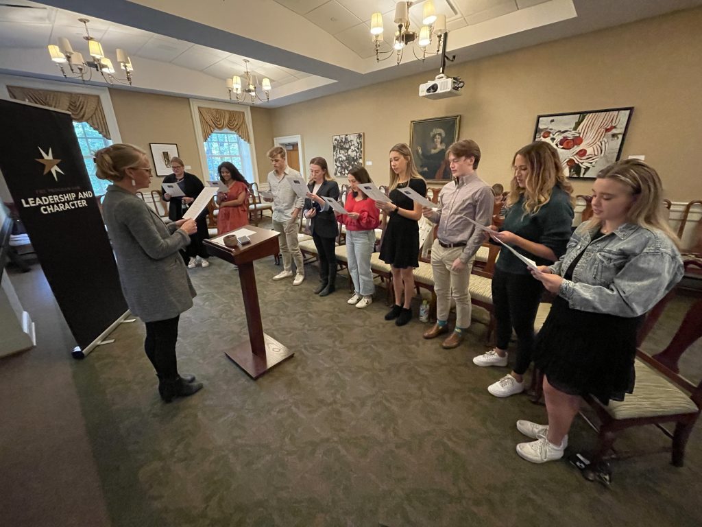 ambassadors reading during initiation