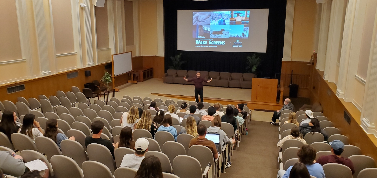 professor lecturing in auditorium