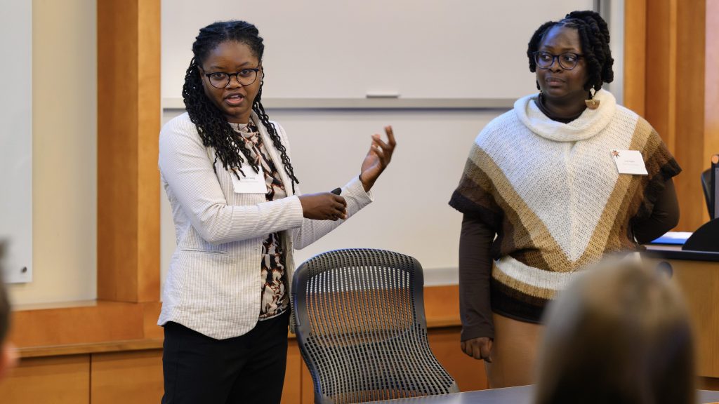 two women speak at a character education conference