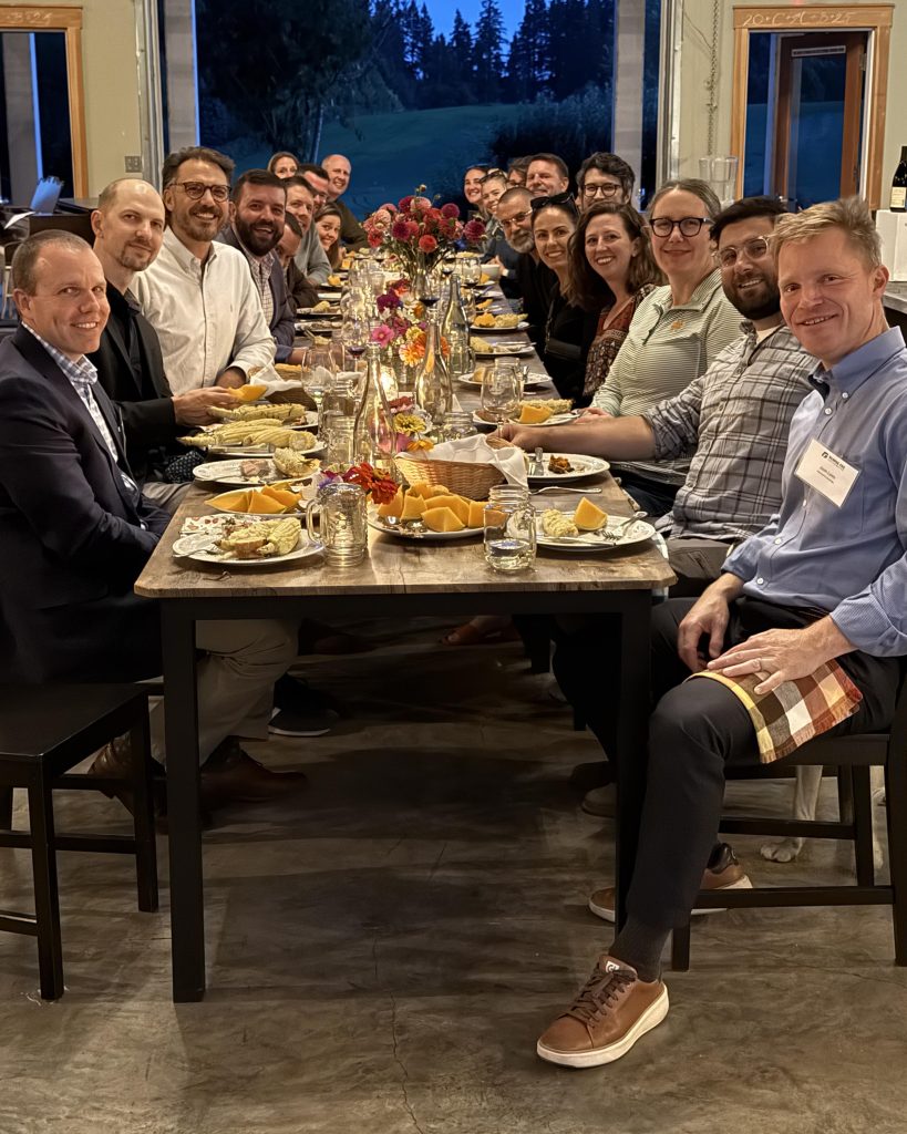 The attendees at a dinner table.
