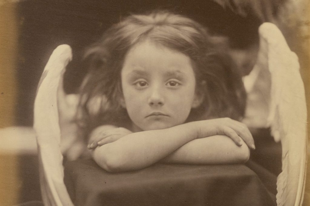 little girl dressed up with angel wings
