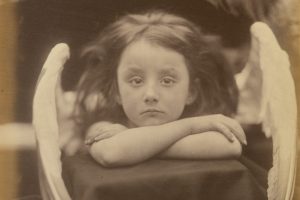 little girl dressed up with angel wings