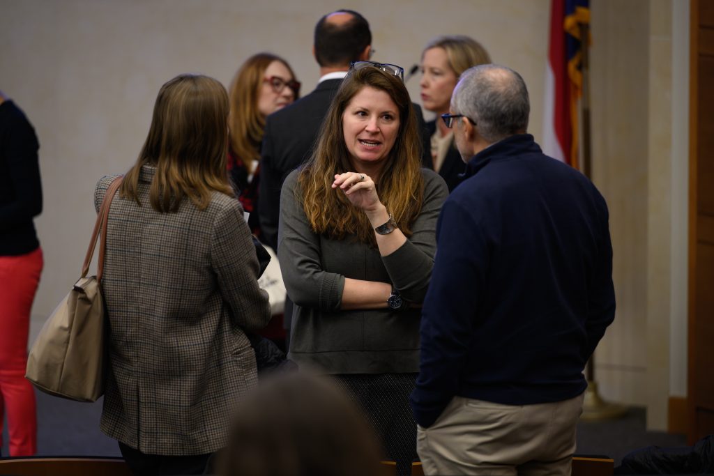 conference participants chat between sessions