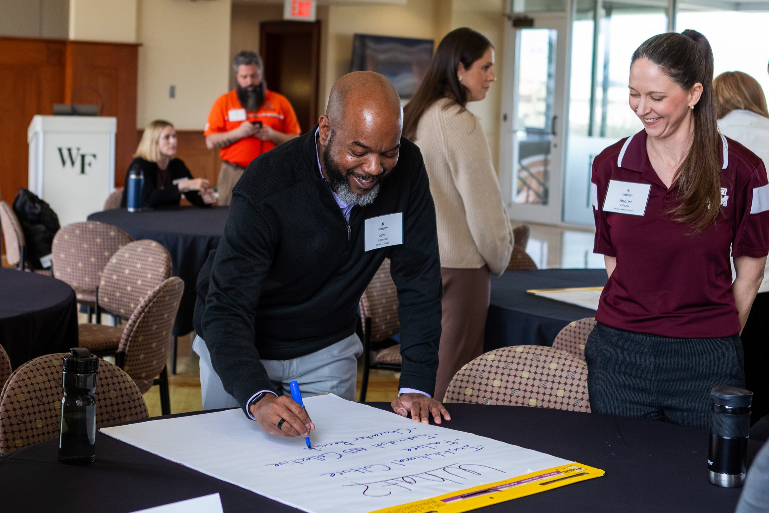 Participants do a workshop activity at an Competitive Edge, an ECI convening about character in athletics.