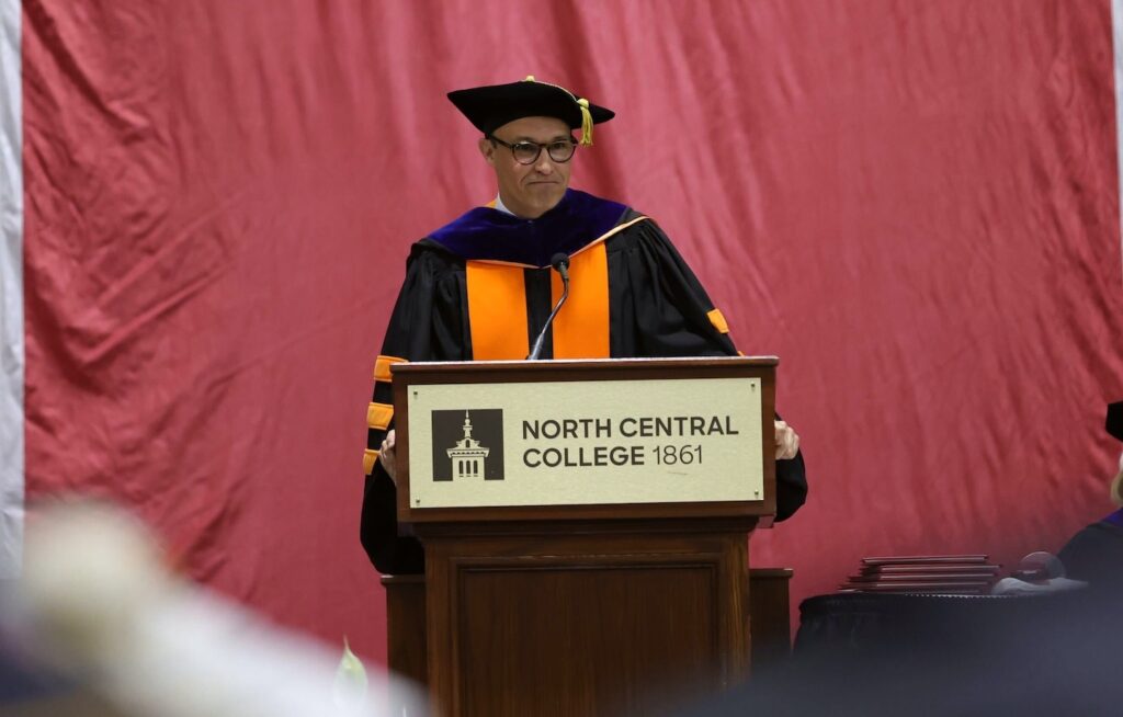 Michael Lamb speaking at a North Central College commencement ceremony