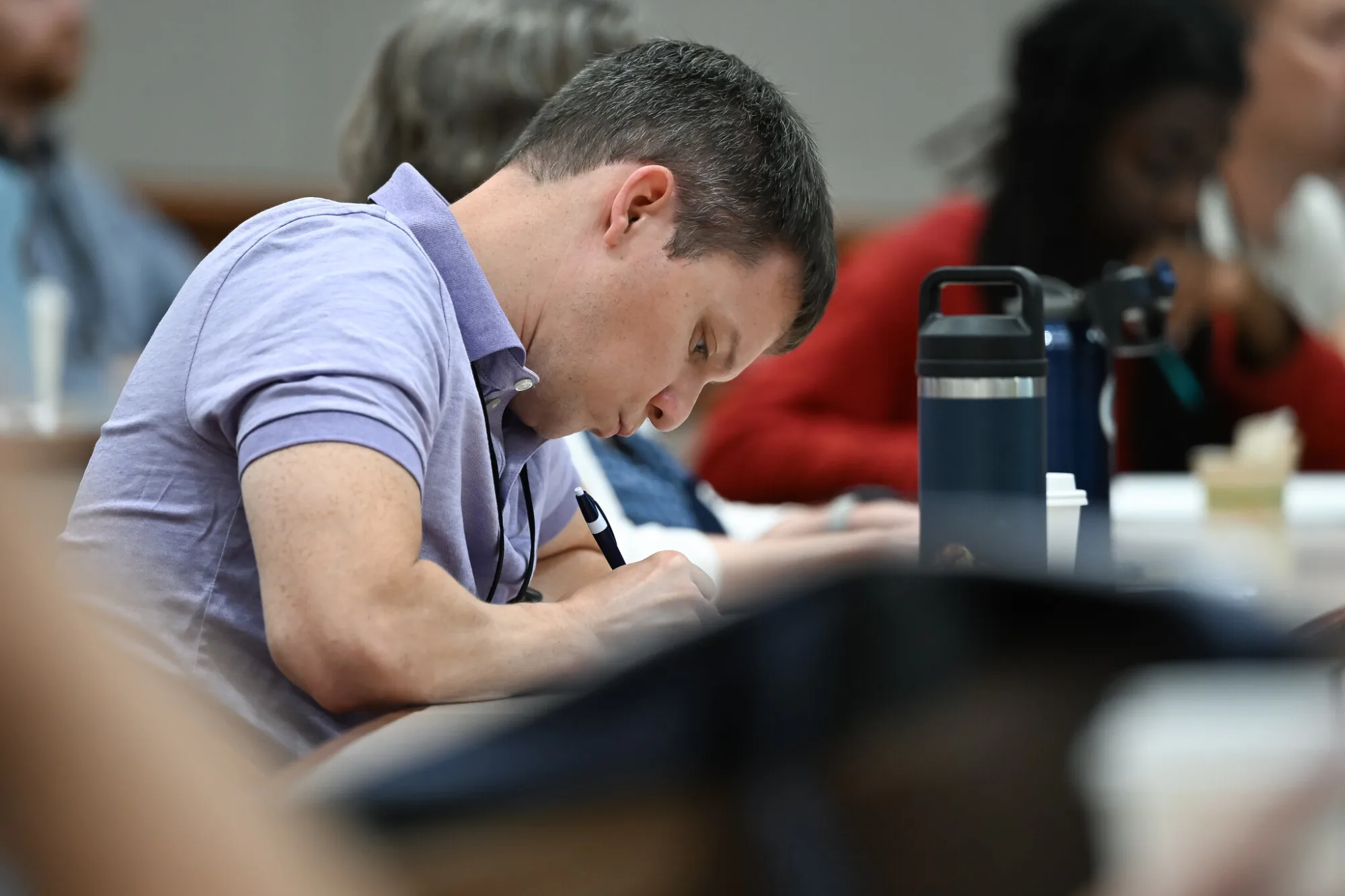 Student jotting down notes