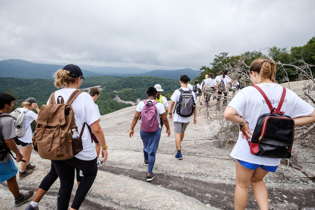 Wake Forest first year students in the WakeWell pre-orientation program hike the strenuous loop trail at Stone Mountain State Park.