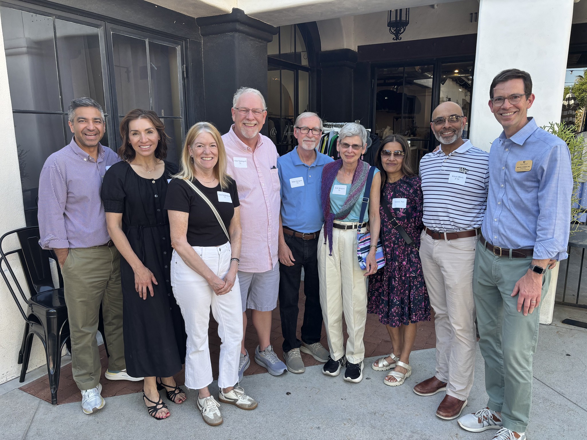 Dr. Michael Shuman - Director of the Center for Learning, Access, and Student Success - and a group of Tucson Wake Foresters stand on the patio of Union Public House where they met for a casual Wake Forest reception.