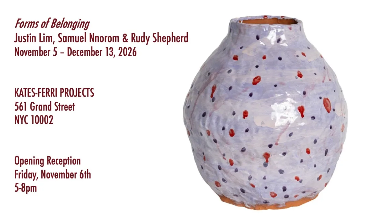 Hand-painted and glazed purple clay vase painted with a blue and red scattering of dots