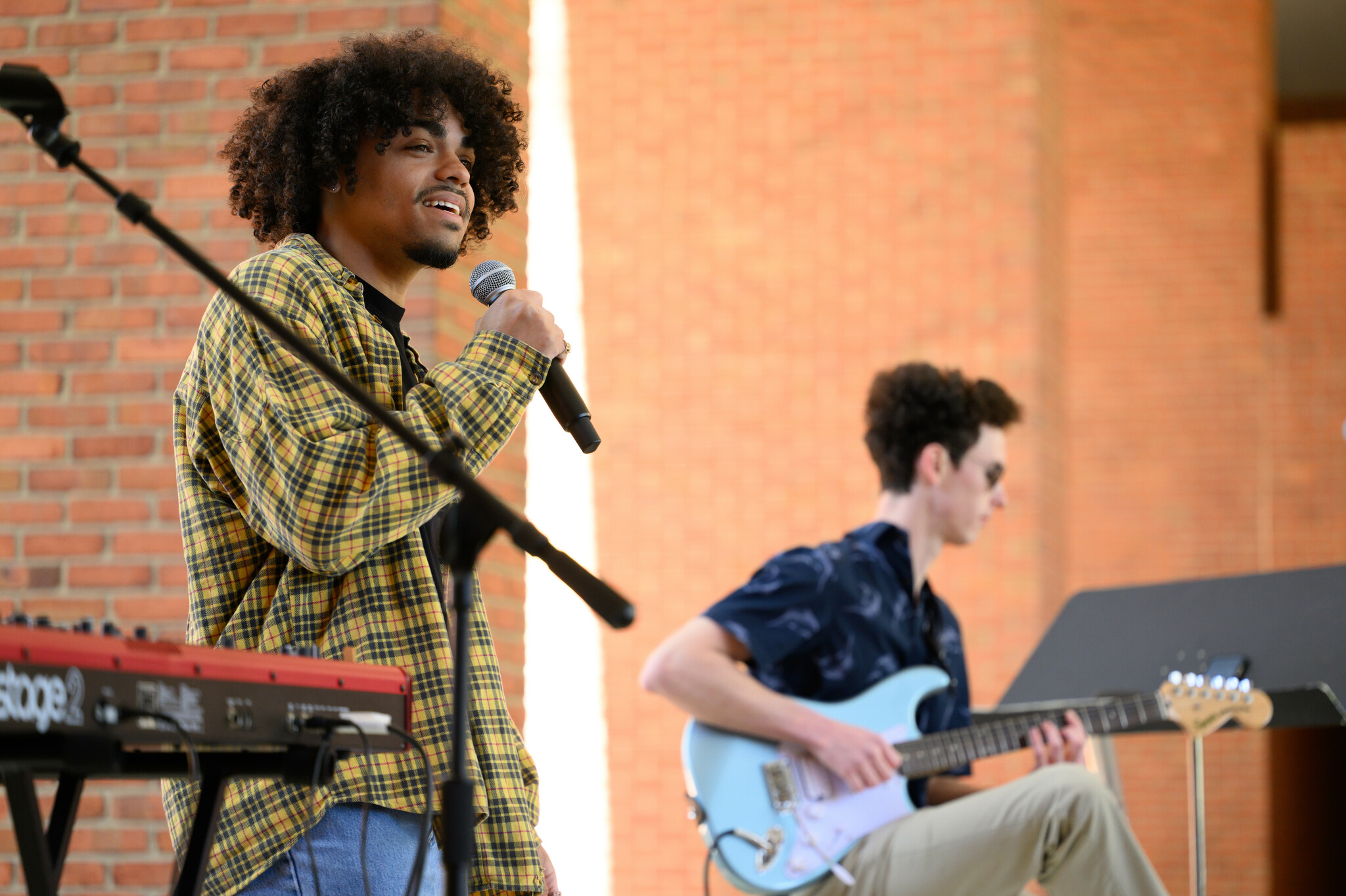 Students, faculty, staff, and community members attend the second annual Wakeville, a student-led, interdisciplinary arts festival on Saturday, April 6,2024 at Scales Fine Arts Center at Wake Forest University. Wakeville had many creative offerings in and around Scales Fine Arts Center and Davis Field, including music, dance, theater, visual art, film, comedy and more. The WFU Choirs perform on the stage at Brendle Recital Hall.