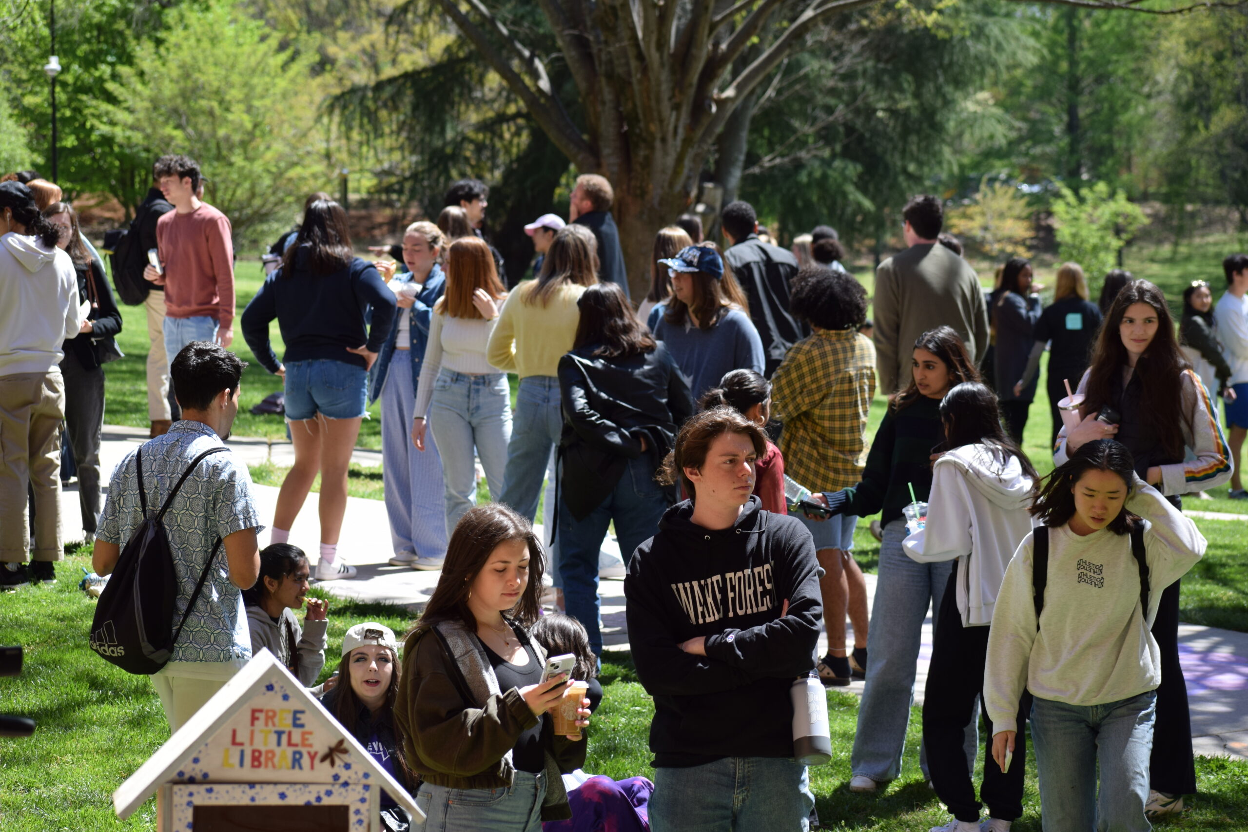 Students, faculty, staff, and community members attend the second annual Wakeville, a student-led, interdisciplinary arts festival on Saturday, April 6,2024 at Scales Fine Arts Center at Wake Forest University. Wakeville had many creative offerings in and around Scales Fine Arts Center and Davis Field, including music, dance, theater, visual art, film, comedy and more. The WFU Choirs perform on the stage at Brendle Recital Hall.
