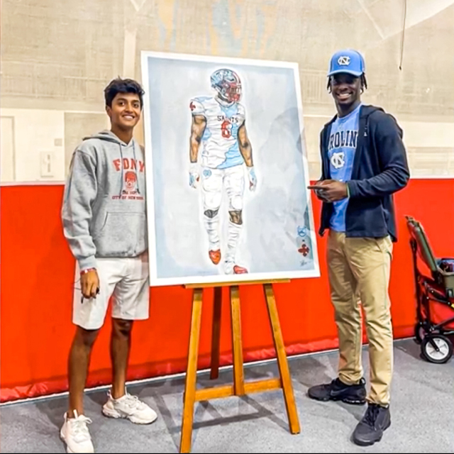 Artist presents portrait to an athlete