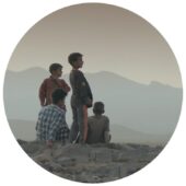 A group of boys looking at a landscape