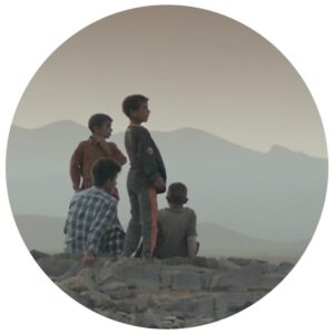 A group of boys looking at a landscape