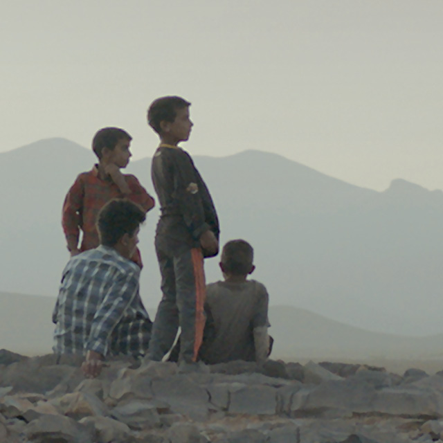 A group of boys looking at a landscape