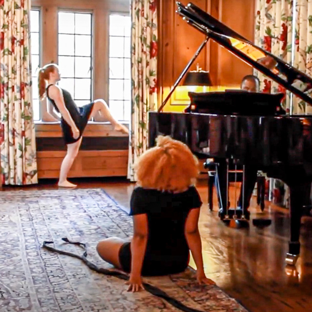 Dancers perform in a historic room